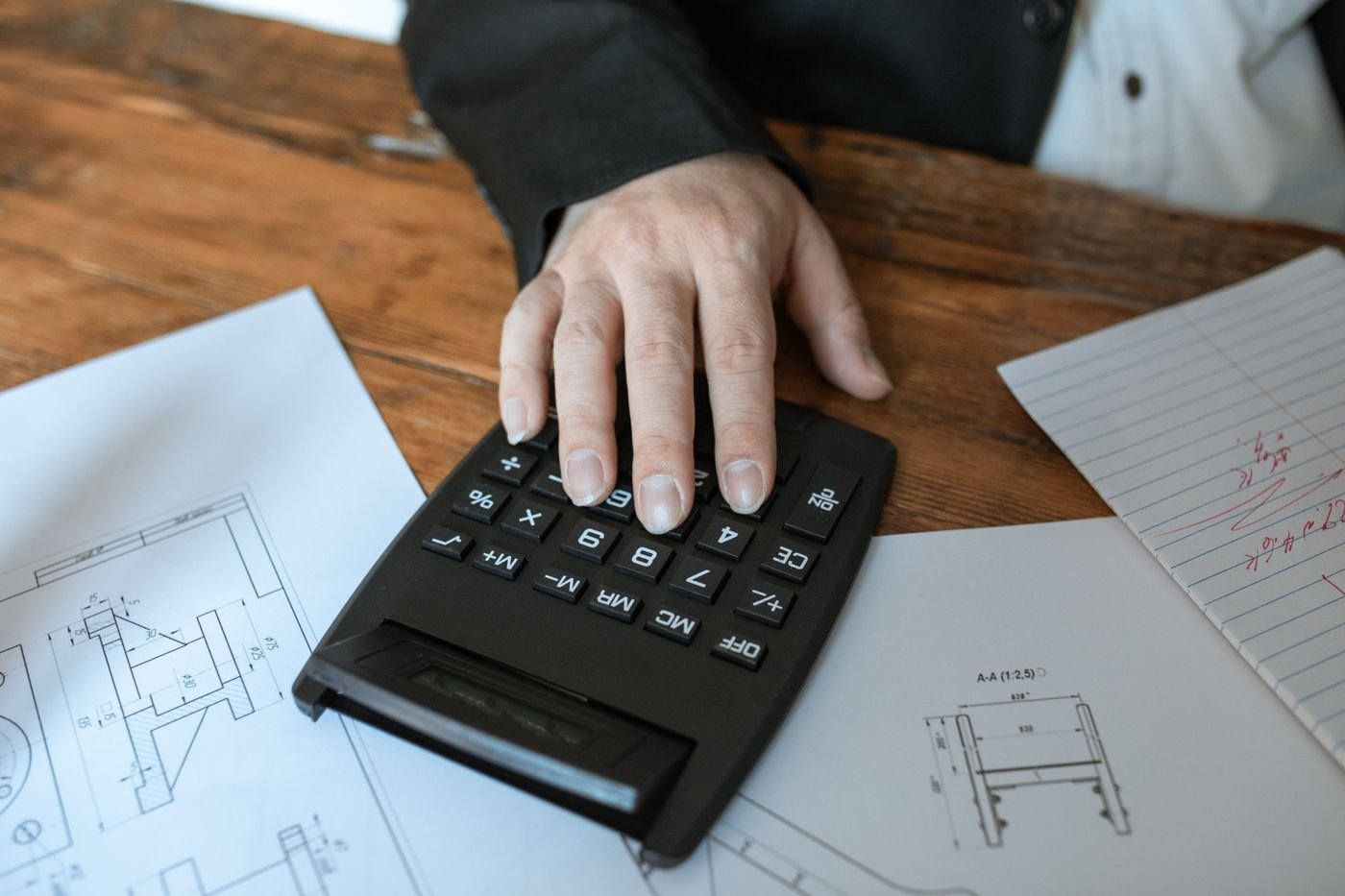 Engineer preparing drawings and a bill of quantities